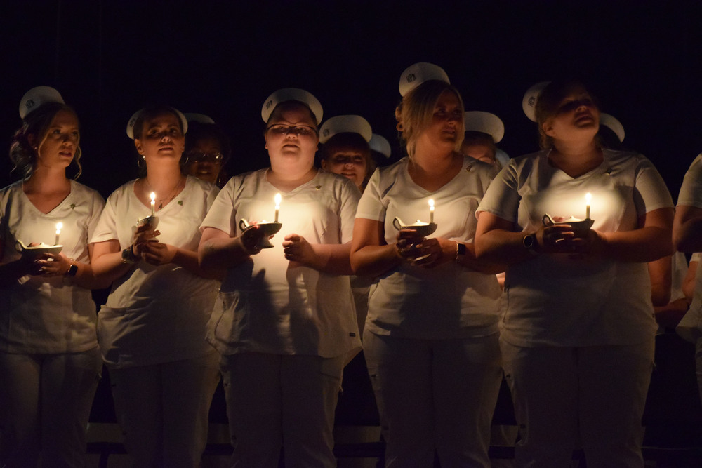 Adult LPN students participating in candle-lighting ceremony