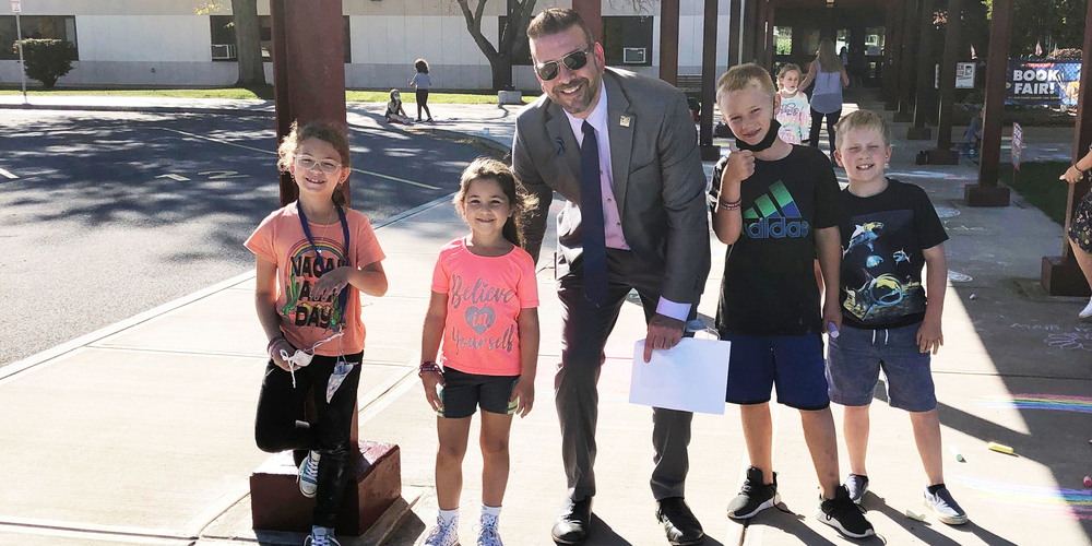 Frankfort-Schuyler Superintendent Joseph Palmer with Frankfort elementary students