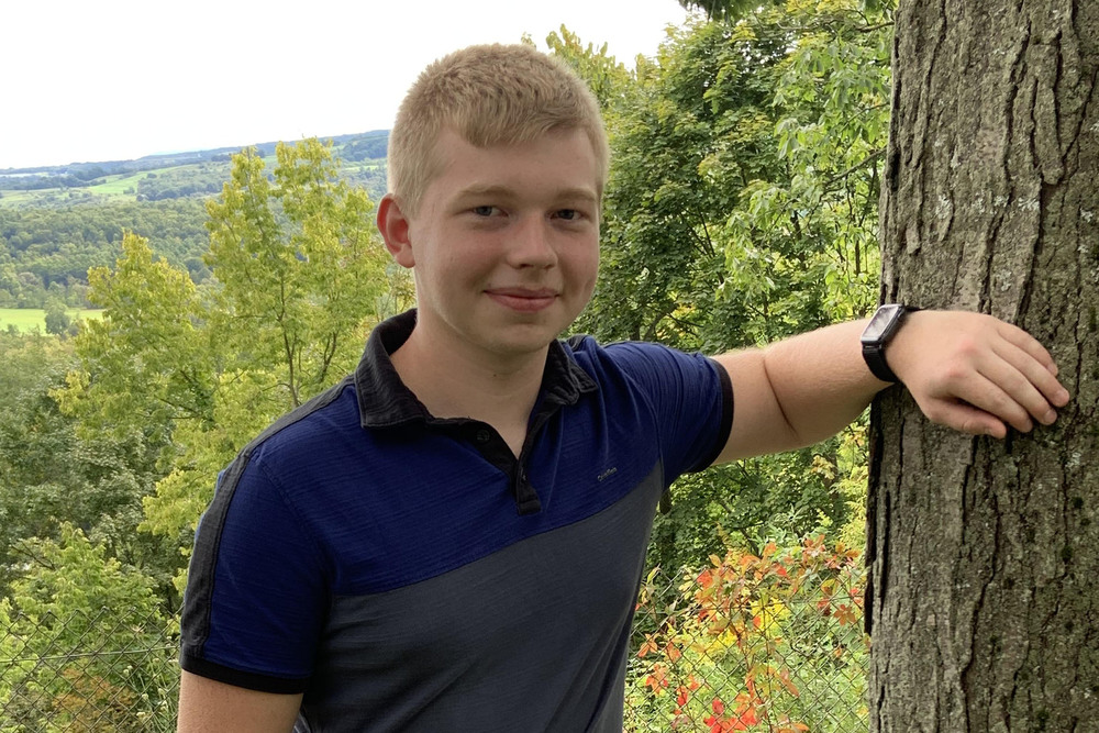 VP-TECH student Zack Kleist poses outside by a tree