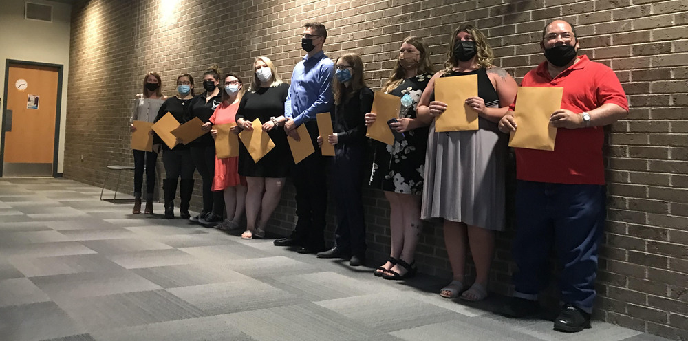 Adult Education graduates lined up in the lobby of the WEB Complex