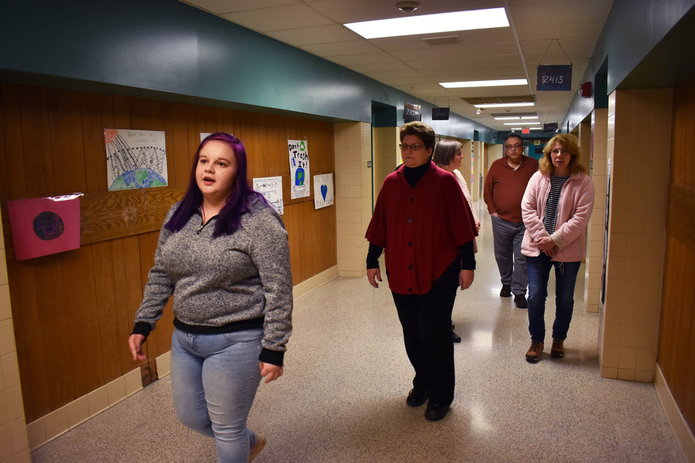 Student gives tour through hallway at Remington school building