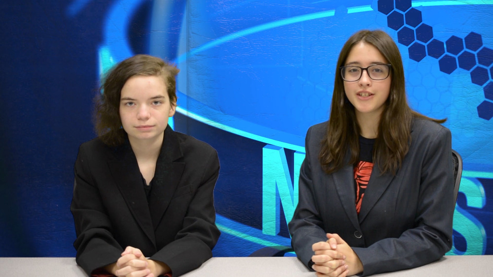 Visual Communications Media Arts students on mock news set