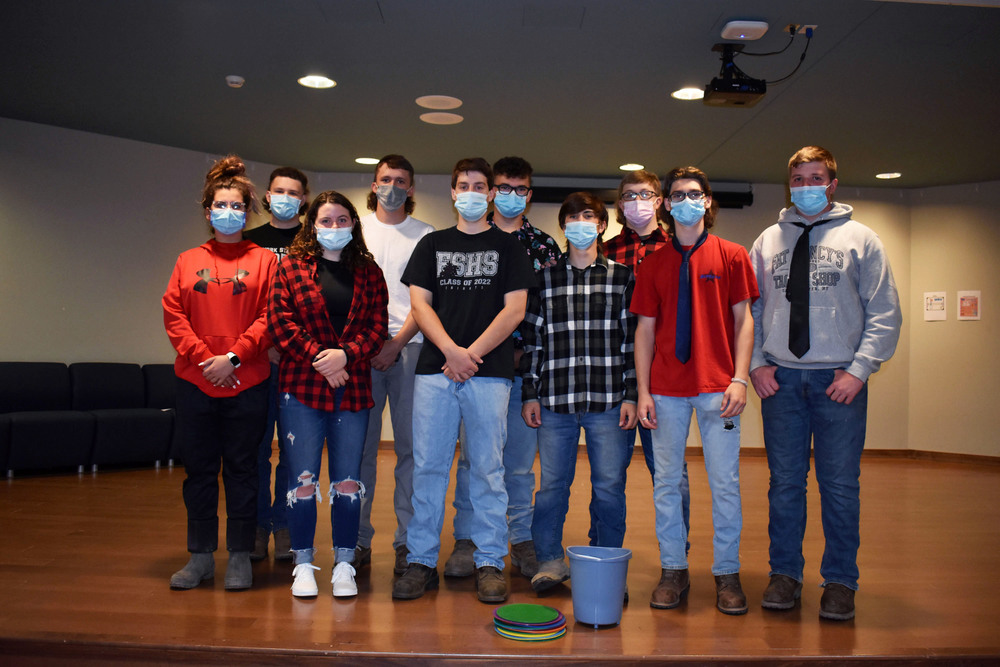 Conservation students pose together on stage