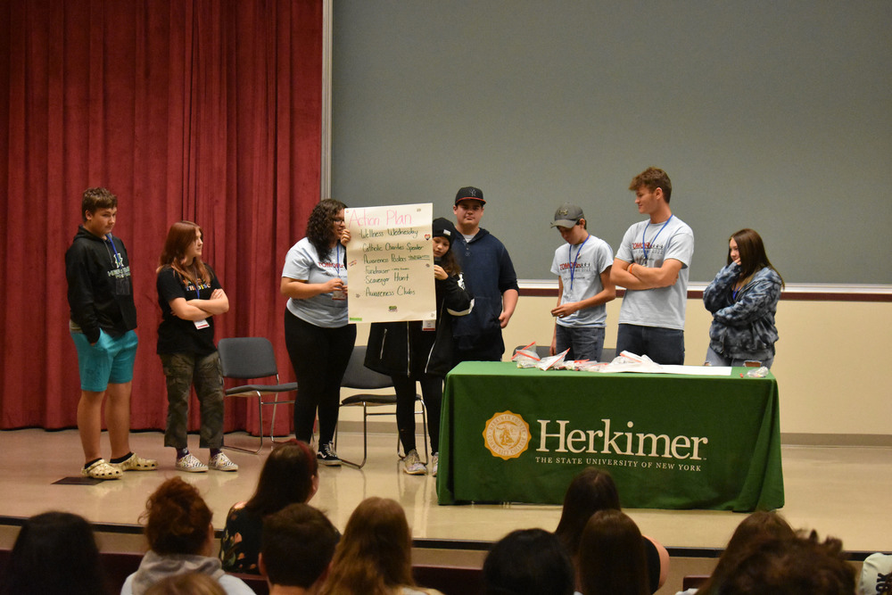 VP-TECH students presenting on stage at Herkimer College
