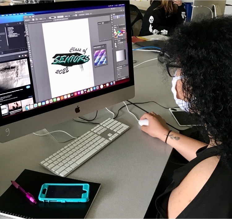 Visual Communications student works on a design on the computer