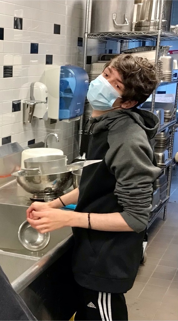 A Culinary student doing dishes