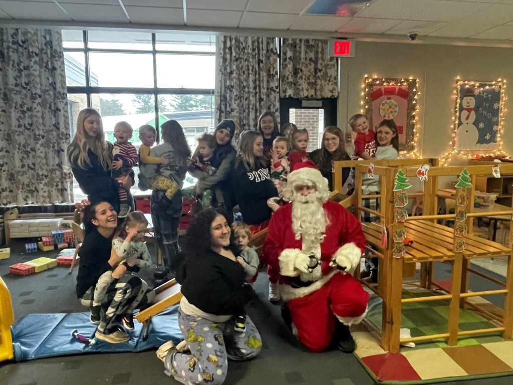 Child and Family Services students and Toddler Play Group children with Santa
