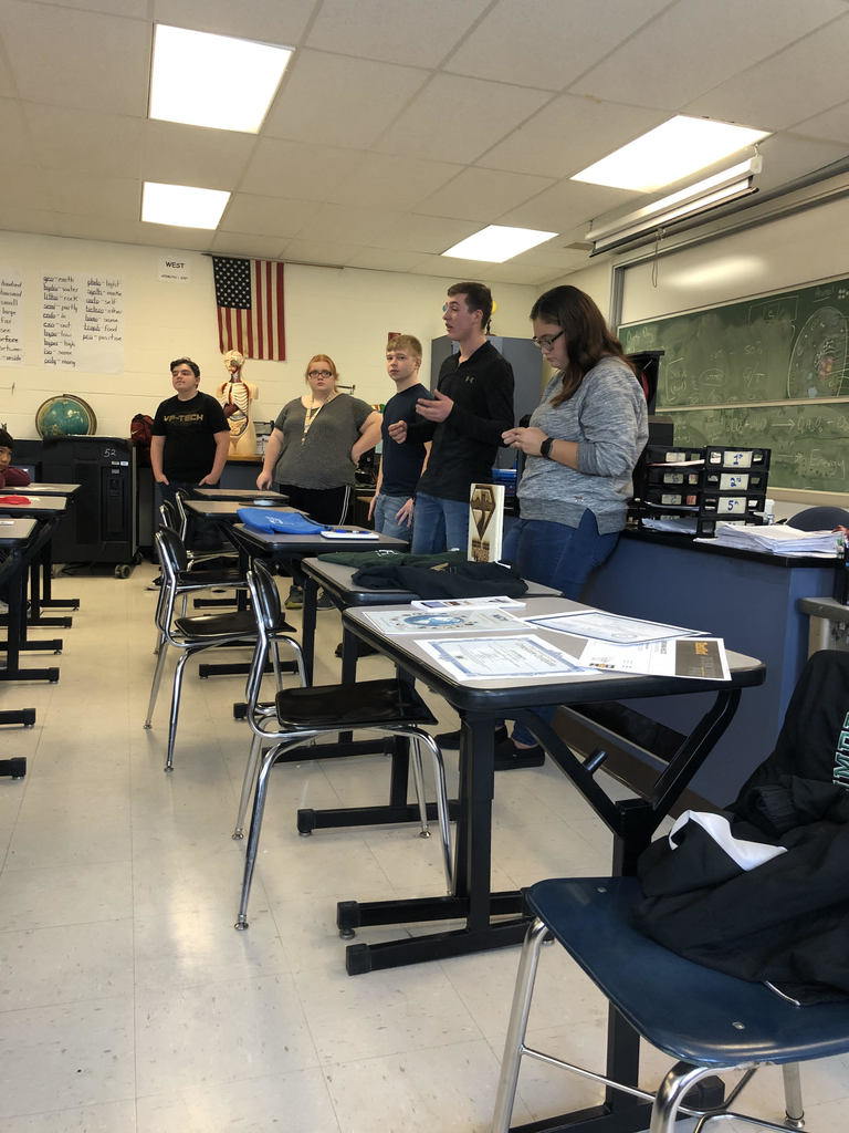 Five VP-TECH students presenting in a classroom at CVA