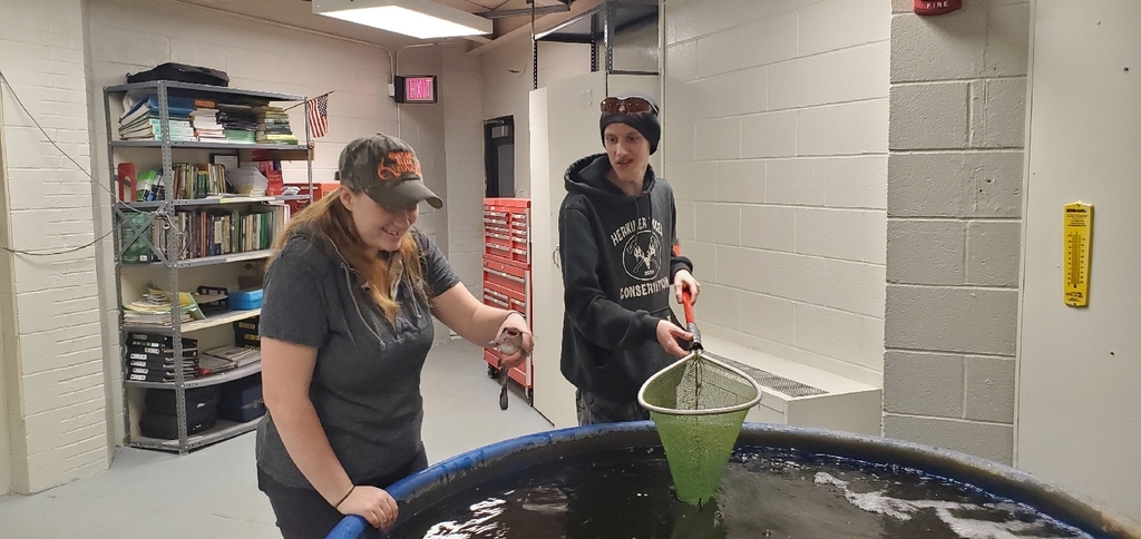 conservation students with a fish