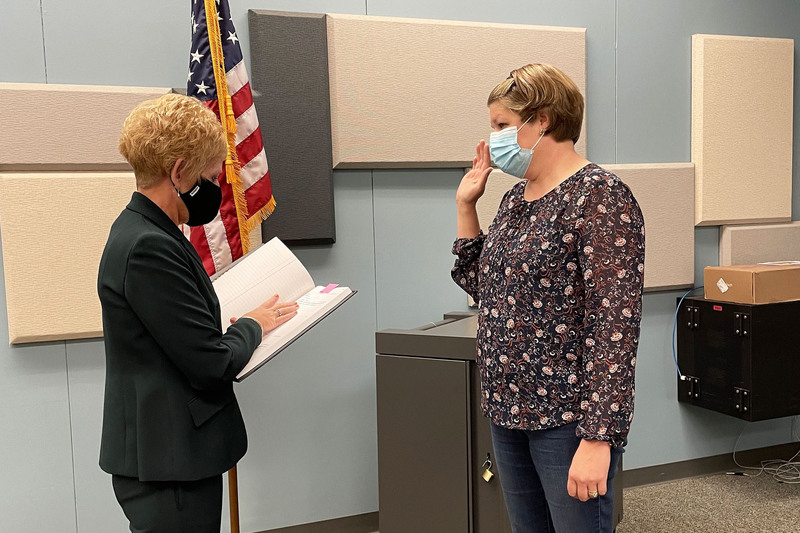Holly Pullis is sworn in by Board Clerk Shawn Maxson