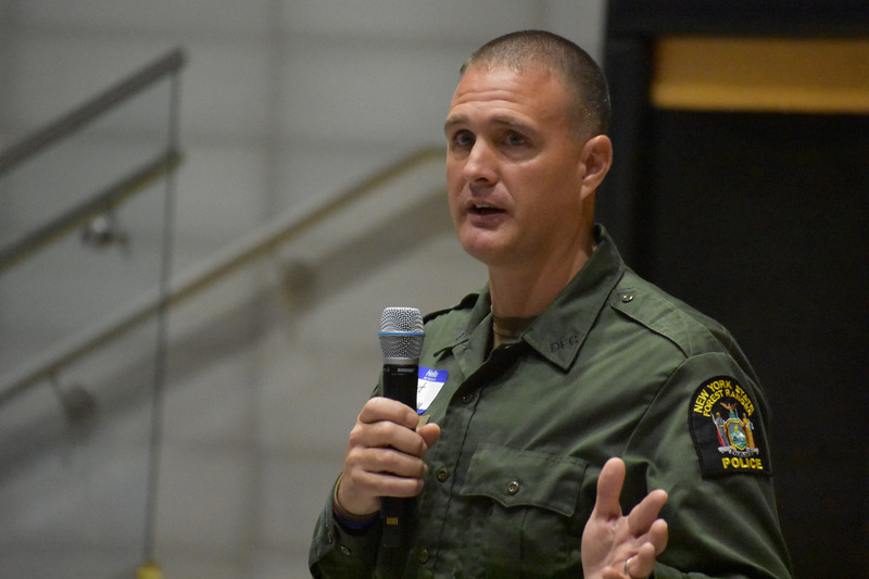 Closeup photo on New York state Forest Ranger Rob Piersma as he speaks to Gregory B. Jarvis students in the auditorium