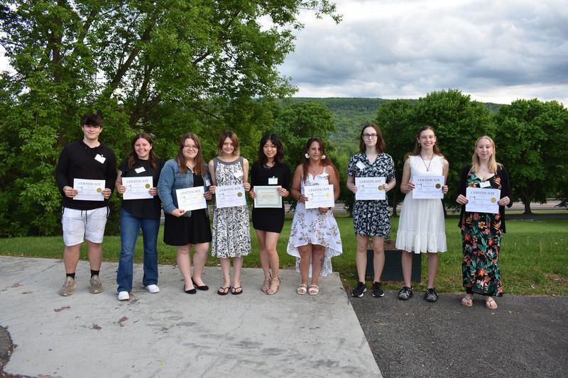 Scholarship winners pose with certificates