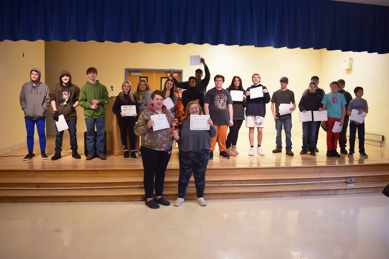 Pathways Academy students posing on stage with award certificates
