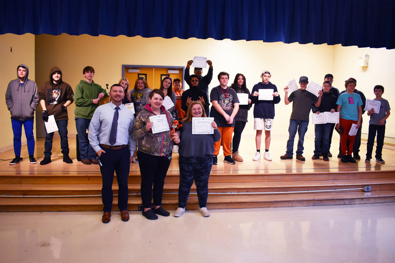 Pathways Academy students posing on stage with award certificates