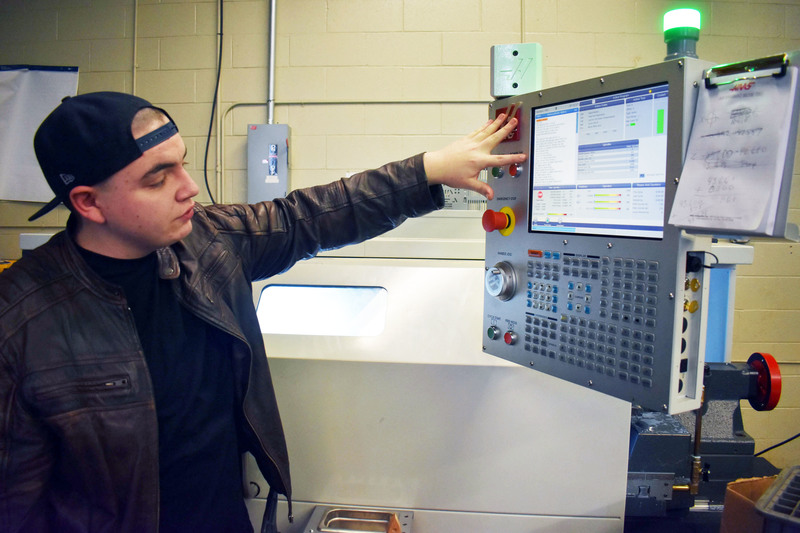 Advanced Manufacturing student showing how CNC lathe control panel works