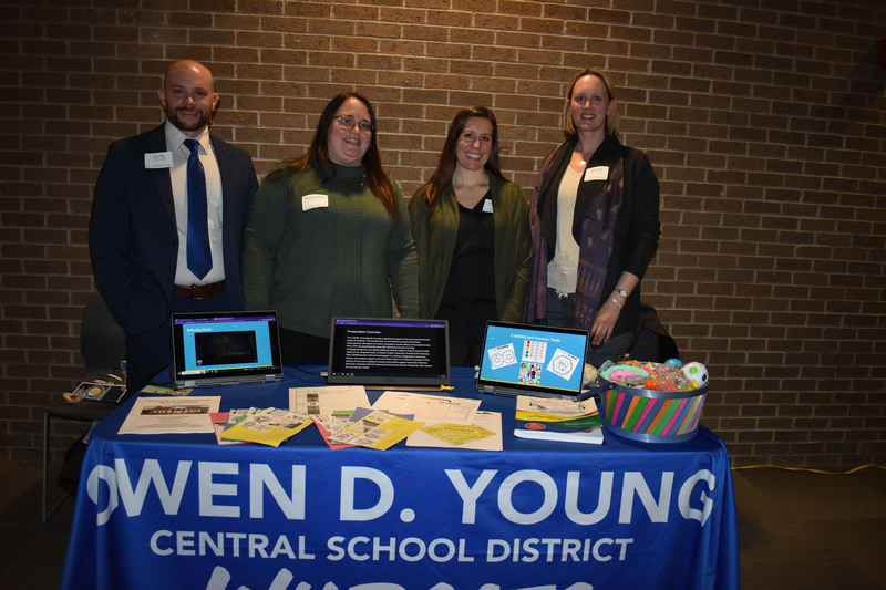 Owen D. Young exhibit with four staff members