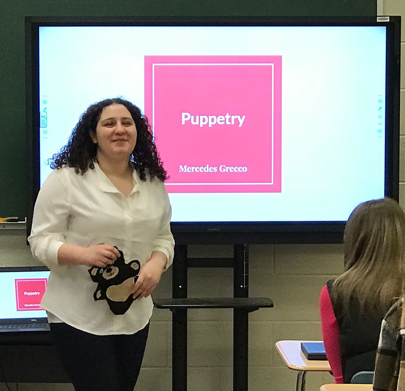 Child and Family Services student giving a presentation on Puppetry in front of class