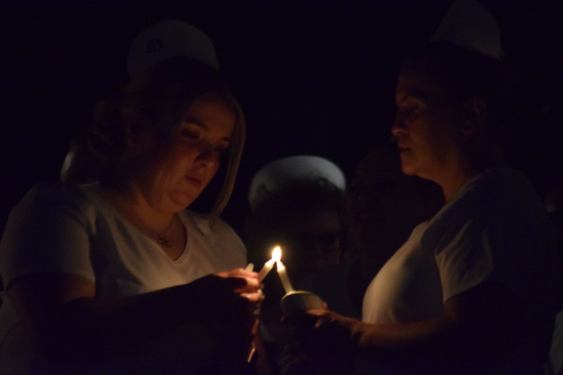 Adult LPN students participating in candle-lighting ceremony