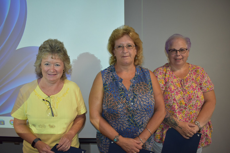 Three staff members with 25 years of service