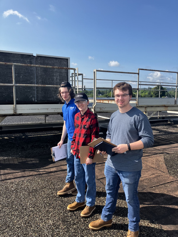 Three VP-TECH interns on ConMed roof