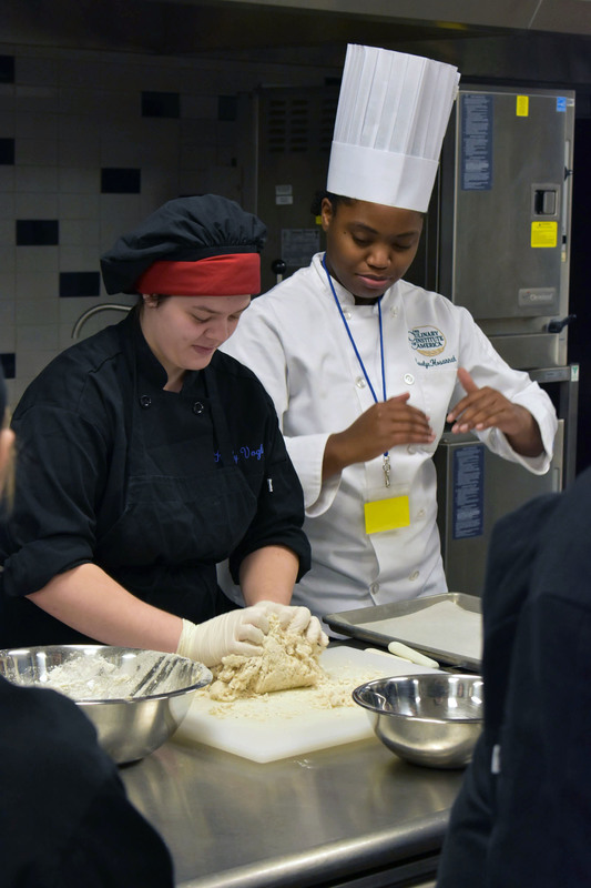 Culinary Institute of America chef tells Herkimer BOCES culinary student how to make dough for naan